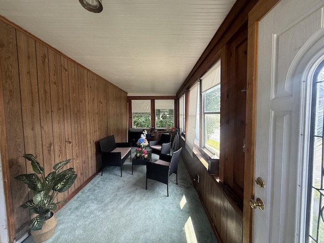 384 Park St, Bristol, CT 06010 - sunroom / solarium featuring carpet flooring and wood walls