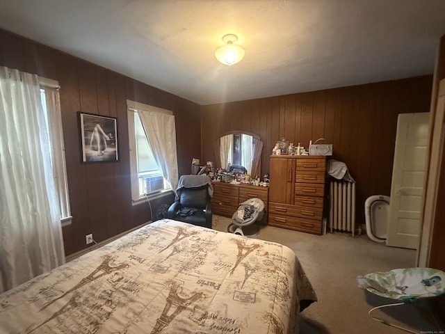 384 Park St, Bristol, CT 06010 - bedroom featuring radiator heating unit, carpet flooring, and wood walls