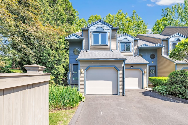 15 Perry Ave Unit D1, Norwalk, CT 06850 - townhome / multi-family property with driveway, an attached garage, and roof with shingles