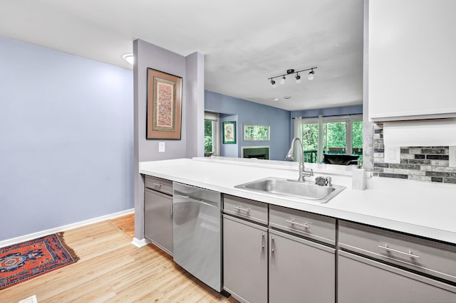 15 Perry Ave Unit D1, Norwalk, CT 06850 - kitchen featuring dishwasher, gray cabinetry, light countertops, light wood-type flooring, and tasteful backsplash
