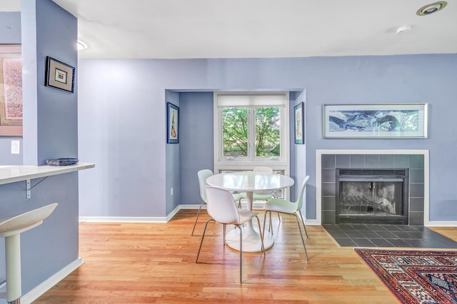 15 Perry Ave Unit D1, Norwalk, CT 06850 - dining area with wood finished floors and a fireplace