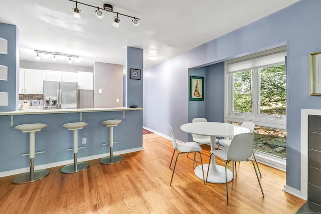15 Perry Ave Unit D1, Norwalk, CT 06850 - dining room featuring track lighting and light wood-style flooring
