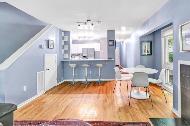 15 Perry Ave Unit D1, Norwalk, CT 06850 - dining room featuring light wood-style floors and rail lighting