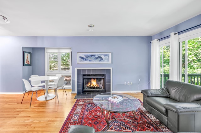 15 Perry Ave Unit D1, Norwalk, CT 06850 - living area with wood finished floors, healthy amount of natural light, and a tile fireplace
