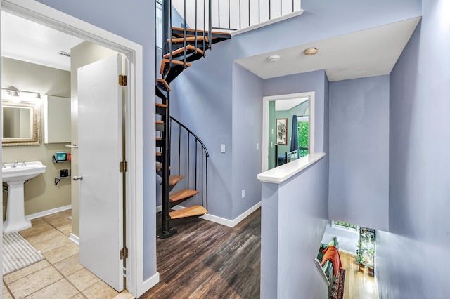 15 Perry Ave Unit D1, Norwalk, CT 06850 - staircase with baseboards and wood finished floors