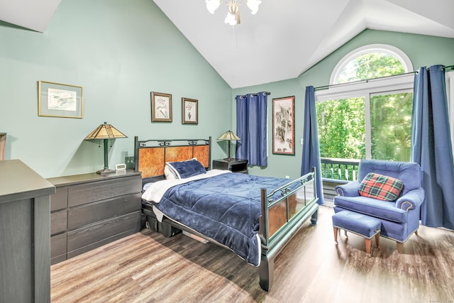 15 Perry Ave Unit D1, Norwalk, CT 06850 - bedroom featuring wood finished floors, access to outside, and high vaulted ceiling