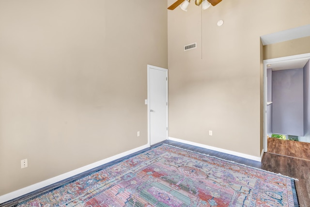 15 Perry Ave Unit D1, Norwalk, CT 06850 - unfurnished room featuring ceiling fan, a towering ceiling, and wood finished floors
