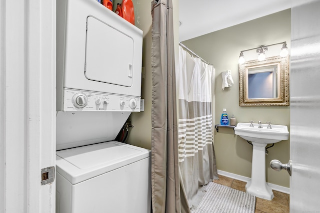 15 Perry Ave Unit D1, Norwalk, CT 06850 - washroom featuring estacked washer and dryer and tile patterned flooring