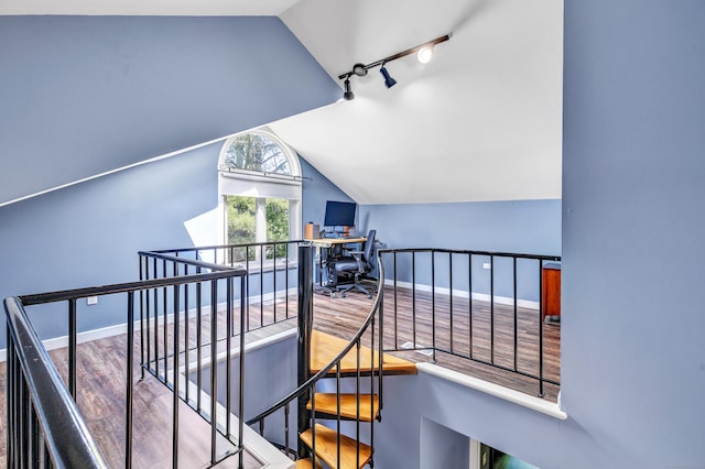 15 Perry Ave Unit D1, Norwalk, CT 06850 - staircase featuring lofted ceiling, rail lighting, and wood finished floors