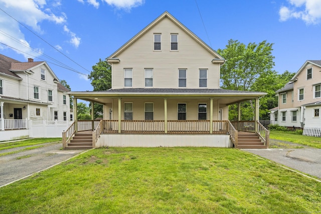 692 Enfield St, Enfield, CT 06082 - farmhouse featuring covered porch and a front lawn