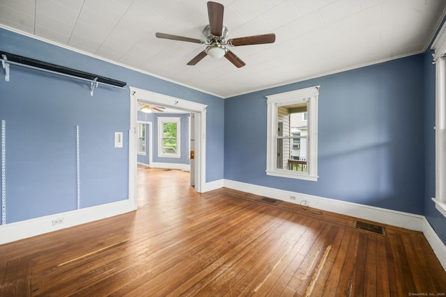 692 Enfield St, Enfield, CT 06082 - spare room with a ceiling fan, crown molding, and hardwood / wood-style floors