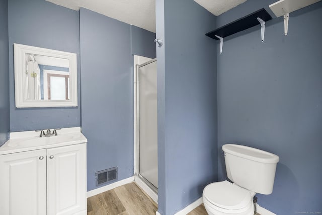 692 Enfield St, Enfield, CT 06082 - bathroom with a shower stall, wood finished floors, and vanity