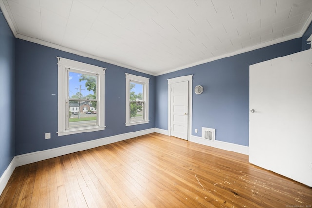 692 Enfield St, Enfield, CT 06082 - empty room featuring crown molding and hardwood / wood-style flooring