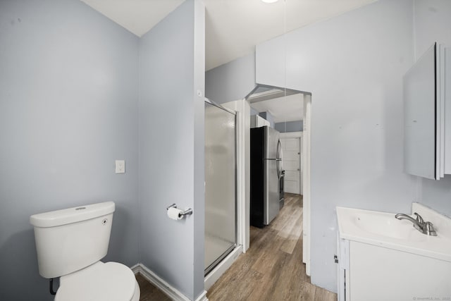 692 Enfield St, Enfield, CT 06082 - bathroom featuring wood finished floors, vanity, and a stall shower