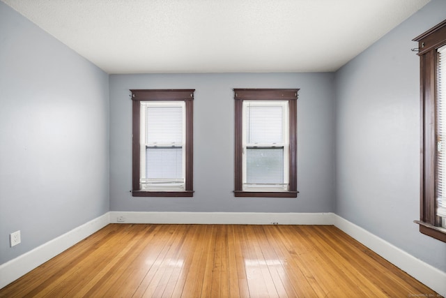692 Enfield St, Enfield, CT 06082 - unfurnished room featuring baseboards and light wood-style flooring