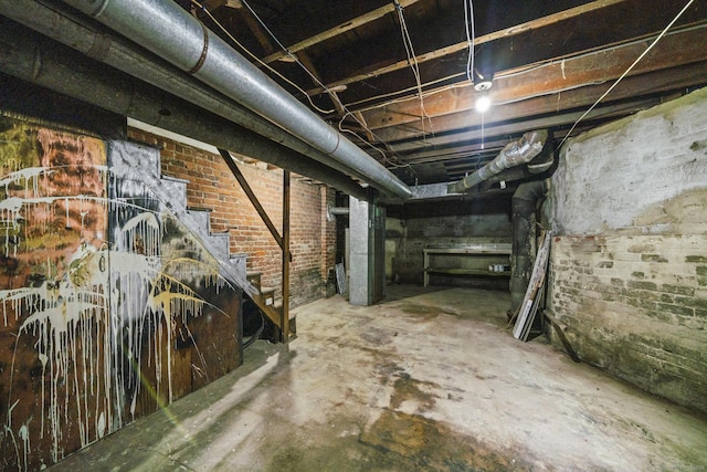 692 Enfield St, Enfield, CT 06082 - unfinished below grade area with stairs and brick wall
