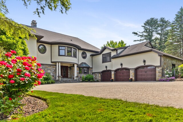 9 Cobtail Way, Simsbury, CT 06070 - french provincial home with stone siding, decorative driveway, and a chimney
