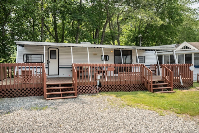 262 Shetucket Tpke Unit 2, Griswold, CT 06351 - view of front of home featuring a deck and view of wooded area