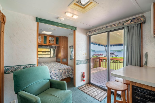262 Shetucket Tpke Unit 2, Griswold, CT 06351 - carpeted bedroom featuring access to outside and a textured wall