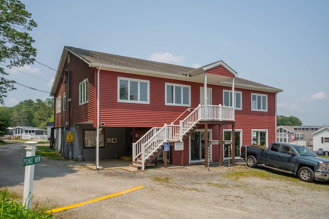 262 Shetucket Tpke Unit 2, Griswold, CT 06351 - view of property featuring stairway and a shingled roof