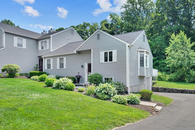 80 Quarry Village Rd, Cheshire, CT 06410 - view of front of house featuring a front lawn and roof with shingles