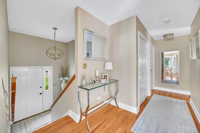 80 Quarry Village Rd, Cheshire, CT 06410 - foyer entrance featuring a chandelier and light wood-style flooring