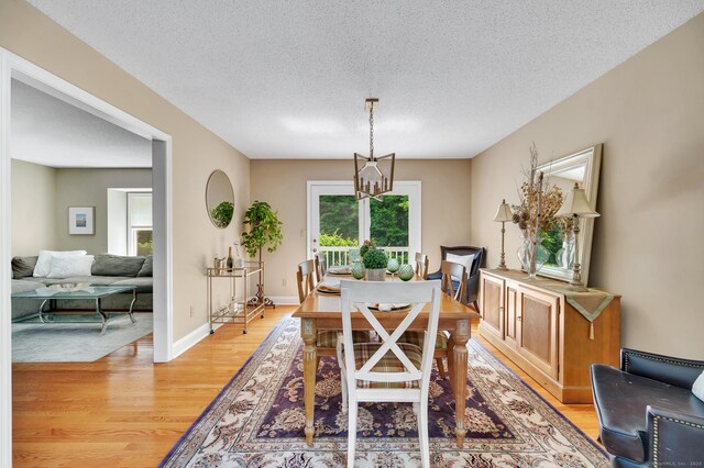 80 Quarry Village Rd, Cheshire, CT 06410 - dining space with plenty of natural light, light wood-type flooring, a textured ceiling, and a chandelier