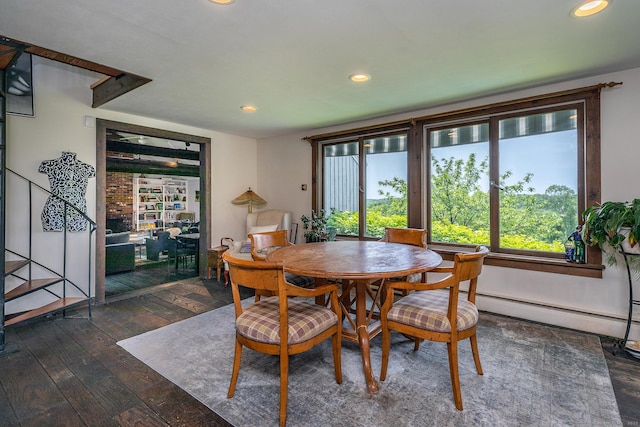 dining space with plenty of natural light, hardwood / wood-style floors, recessed lighting, and a baseboard radiator