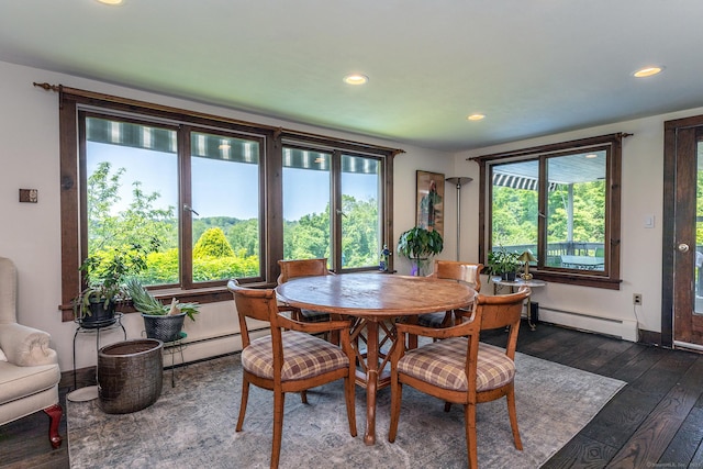 dining area featuring baseboard heating, dark wood finished floors, recessed lighting, and healthy amount of natural light