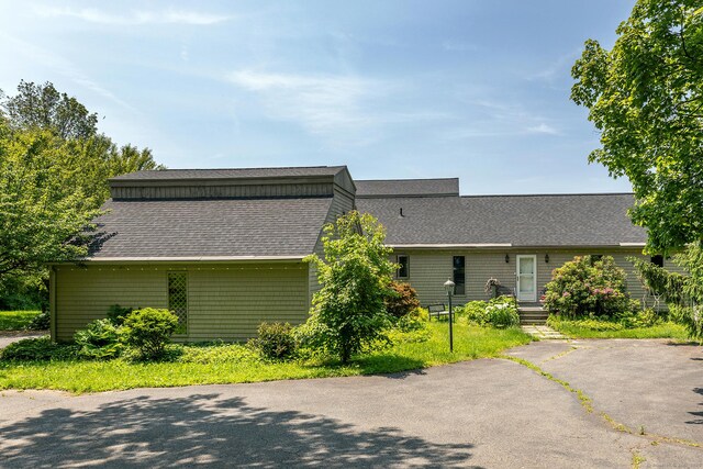 view of front facade with a shingled roof