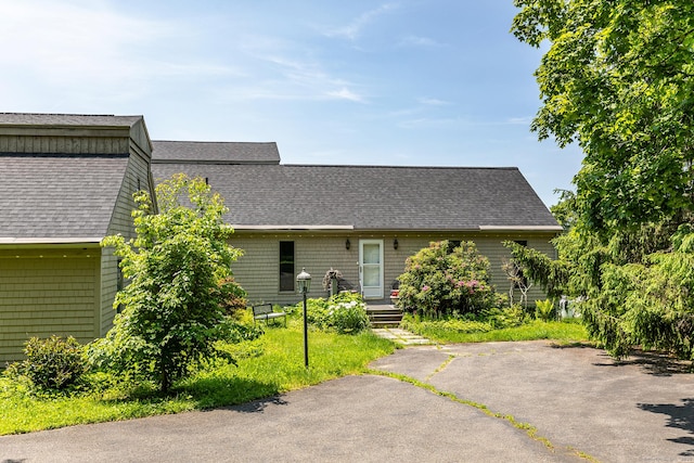 view of front of home with roof with shingles