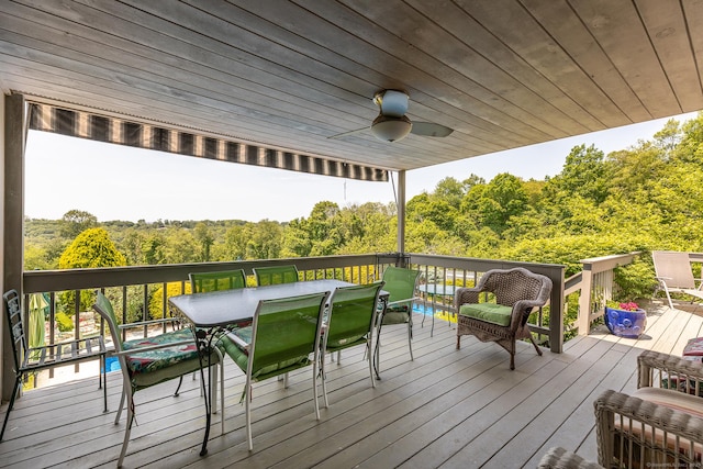 173 Bch Hill Rd E, Bridgewater, CT 06752 - deck featuring outdoor dining area, ceiling fan, and a view of trees