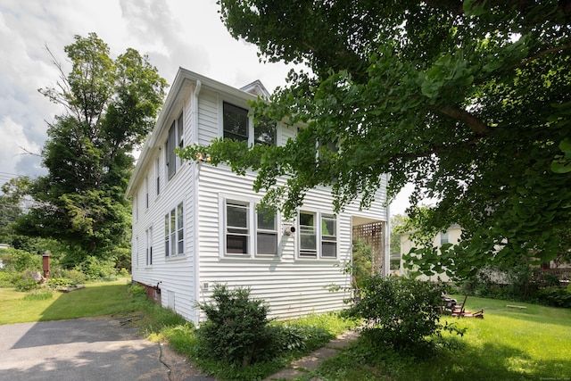 182 Church St, North Canaan, CT 06018 - view of side of home featuring a yard