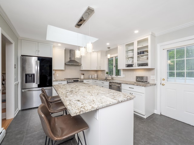 1 Blue Ridge Ln, Wilton, CT 06897 - kitchen featuring appliances with stainless steel finishes, wall chimney range hood, healthy amount of natural light, tasteful backsplash, and crown molding