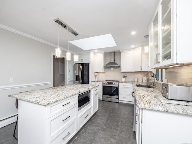 1 Blue Ridge Ln, Wilton, CT 06897 - kitchen featuring stainless steel appliances, wall chimney exhaust hood, a baseboard radiator, a skylight, and decorative backsplash