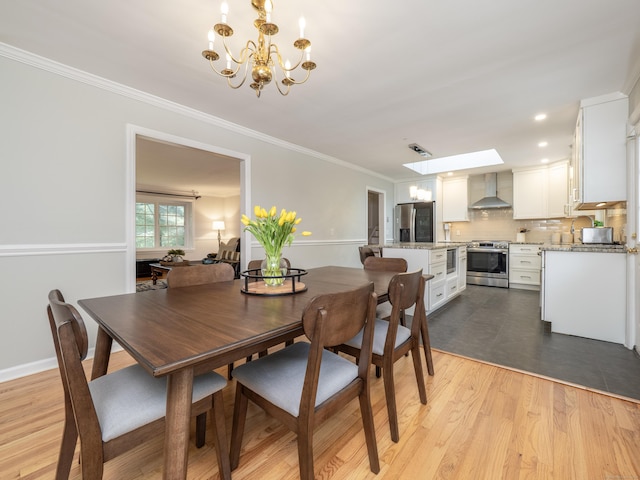 1 Blue Ridge Ln, Wilton, CT 06897 - dining space featuring a chandelier, crown molding, light wood-style flooring, and recessed lighting