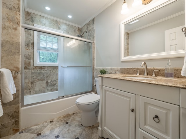 1 Blue Ridge Ln, Wilton, CT 06897 - full bathroom featuring ornamental molding, vanity, combined bath / shower with glass door, and tile walls
