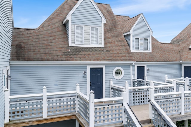 2122 Old Pond Ln Unit 2122, Norwich, CT 06360 - view of front facade featuring a deck and roof with shingles