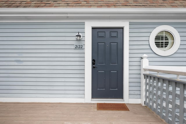 2122 Old Pond Ln Unit 2122, Norwich, CT 06360 - view of exterior entry with a shingled roof
