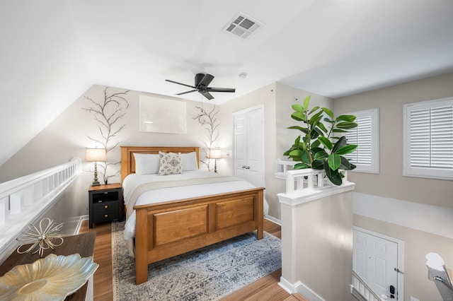 2122 Old Pond Ln Unit 2122, Norwich, CT 06360 - bedroom featuring wood finished floors, a ceiling fan, and vaulted ceiling