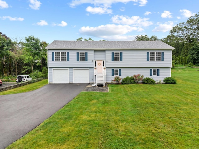 560 Laurel Hill Rd, Norwich, CT 06360 - raised ranch with asphalt driveway, an attached garage, and a front lawn