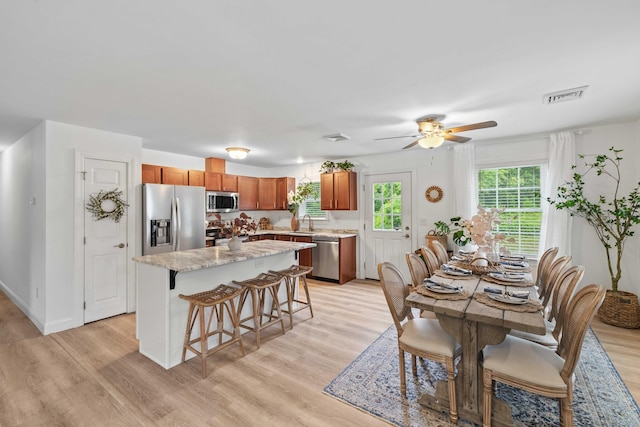 560 Laurel Hill Rd, Norwich, CT 06360 - dining area featuring light wood-style floors and a ceiling fan