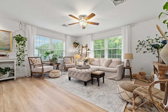 560 Laurel Hill Rd, Norwich, CT 06360 - living area featuring plenty of natural light, a ceiling fan, and wood finished floors