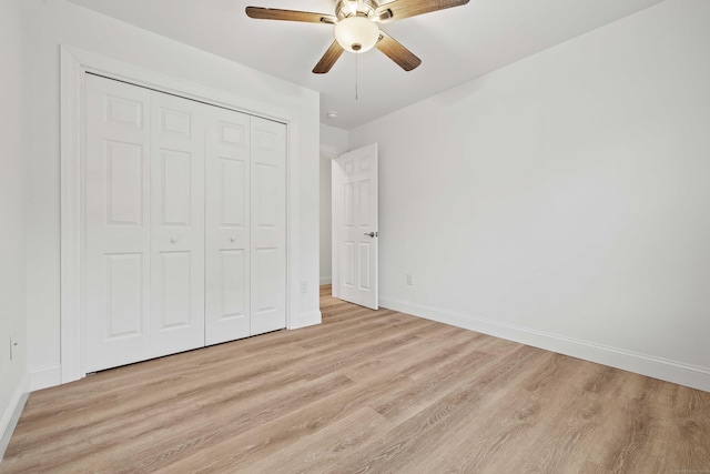 560 Laurel Hill Rd, Norwich, CT 06360 - unfurnished bedroom featuring light wood-type flooring, a closet, and a ceiling fan