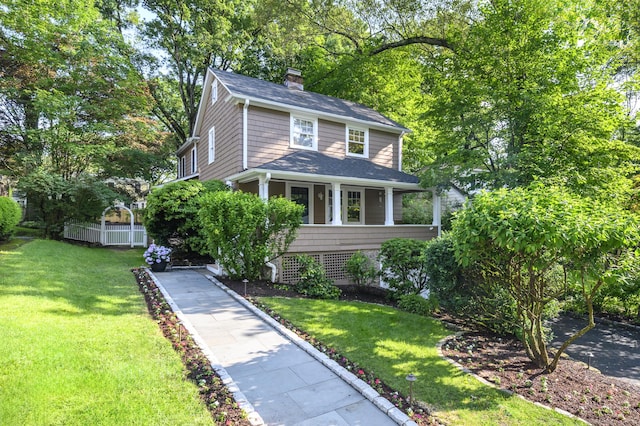 116 Knapp St, Stamford, CT 06907 - american foursquare style home with a chimney, a front yard, covered porch, and a shingled roof