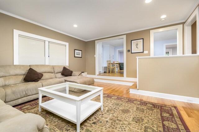 116 Knapp St, Stamford, CT 06907 - living area with light wood-style flooring, ornamental molding, and recessed lighting