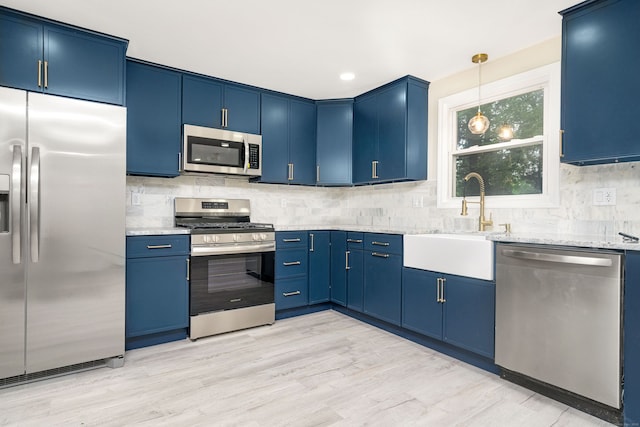 690 Bloomfield Ave, Windsor, CT 06095 - kitchen with stainless steel appliances, blue cabinets, tasteful backsplash, and recessed lighting