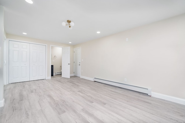 690 Bloomfield Ave, Windsor, CT 06095 - unfurnished bedroom featuring a baseboard radiator, light wood-style flooring, recessed lighting, and a closet