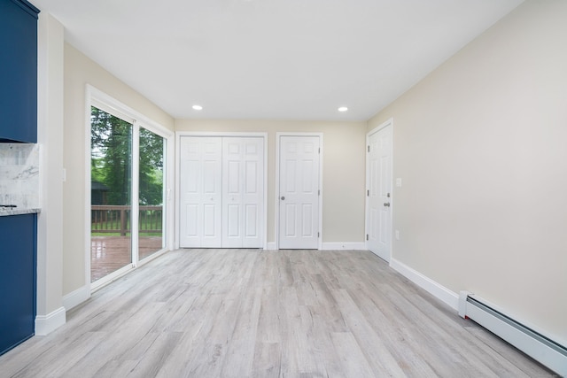 690 Bloomfield Ave, Windsor, CT 06095 - unfurnished bedroom featuring a baseboard heating unit, access to outside, light wood-type flooring, and recessed lighting