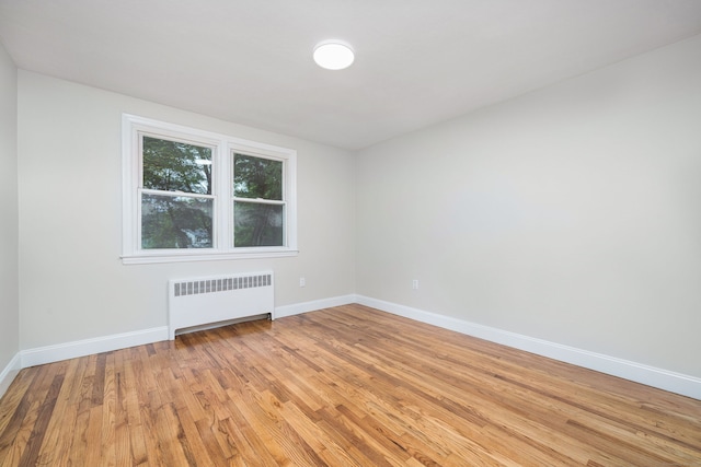690 Bloomfield Ave, Windsor, CT 06095 - spare room featuring radiator and light wood-type flooring